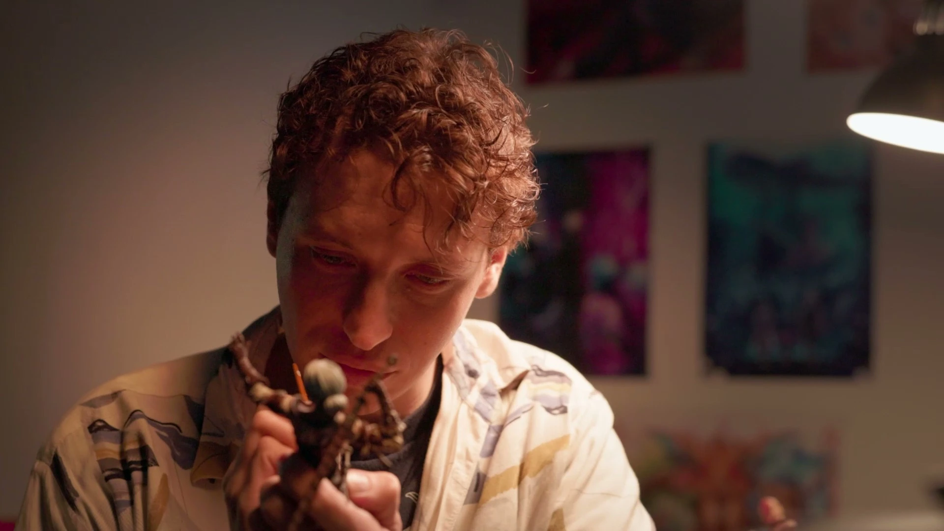 Harry, Figurine & Product Design alumni, focused on sculpting a detailed figurine, showcasing his craftsmanship.