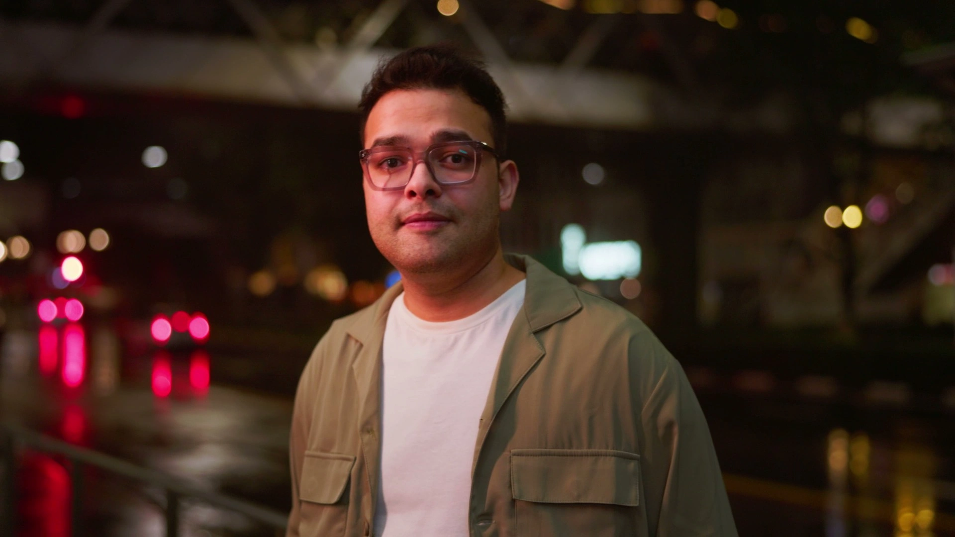 Jatin, Motion Design alumni, featured in the rebranding video, captured in a street scene sharing his creative journey.