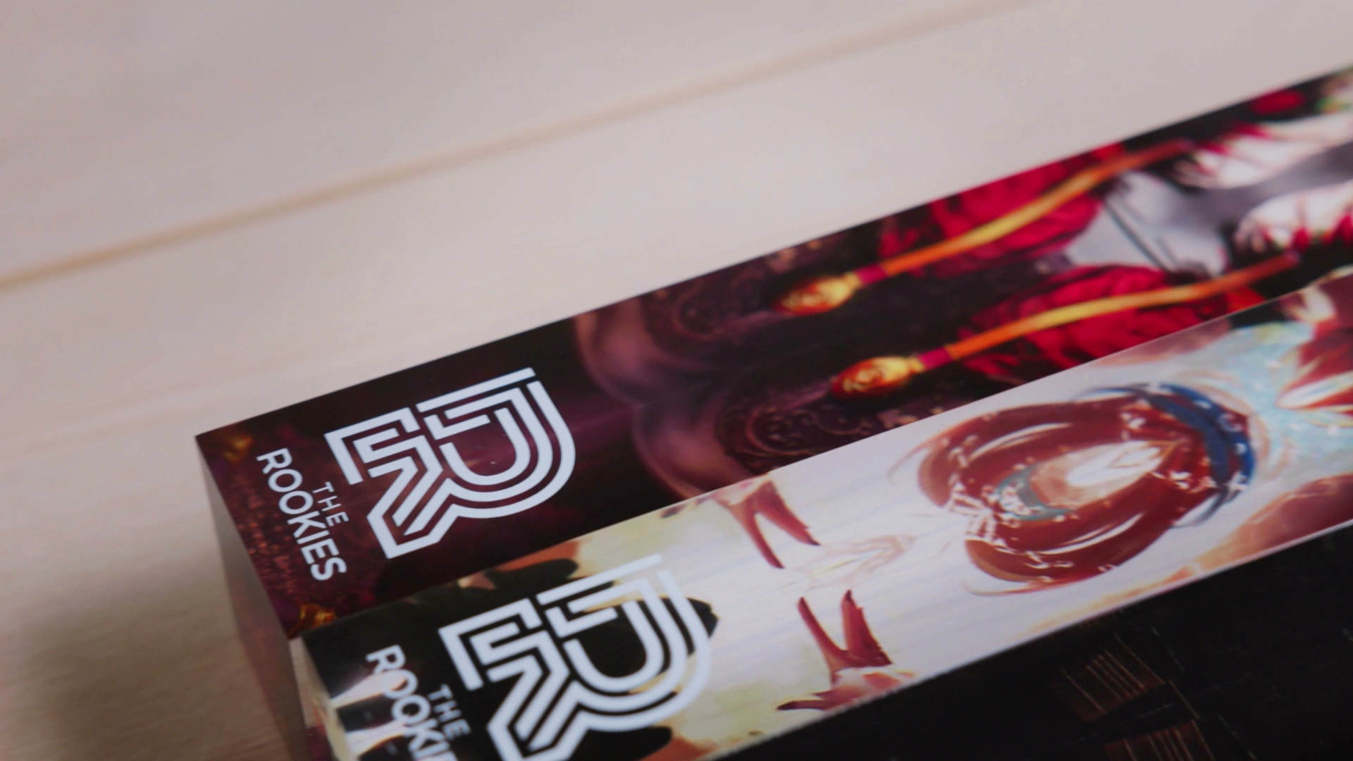 Close-up of three colorful book spines featuring 