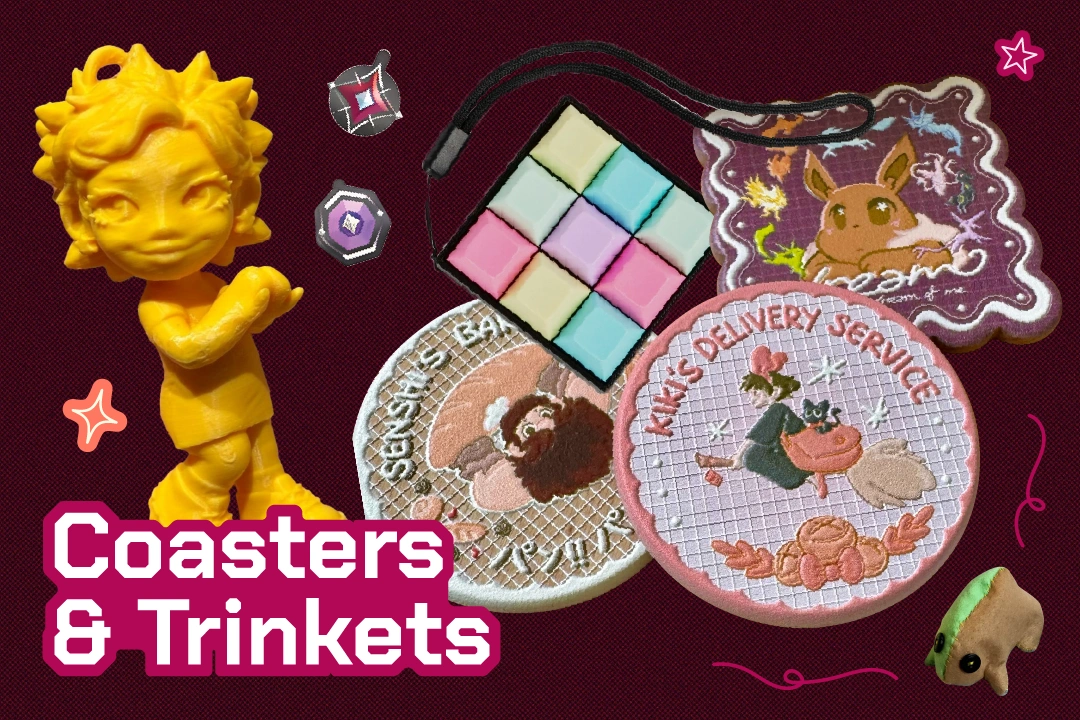 A collection of colorful coasters and trinkets, including a pastel grid, cute charms, and decorative circular coasters with character designs.