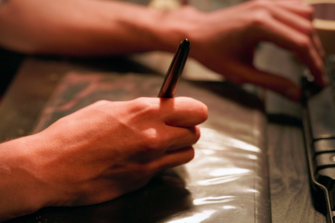 A student drawing using a Wacom tablet.