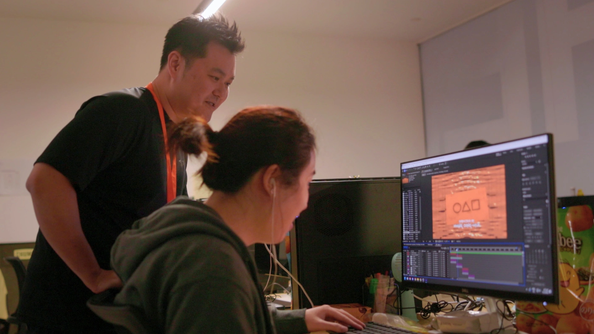 3dsense lecturer guiding a student through 3D animation software on a computer.