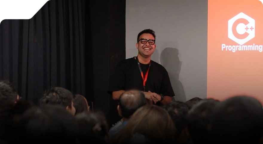 Jatin Gupta smiling while giving a speech at the 3dsense Media School Open House.